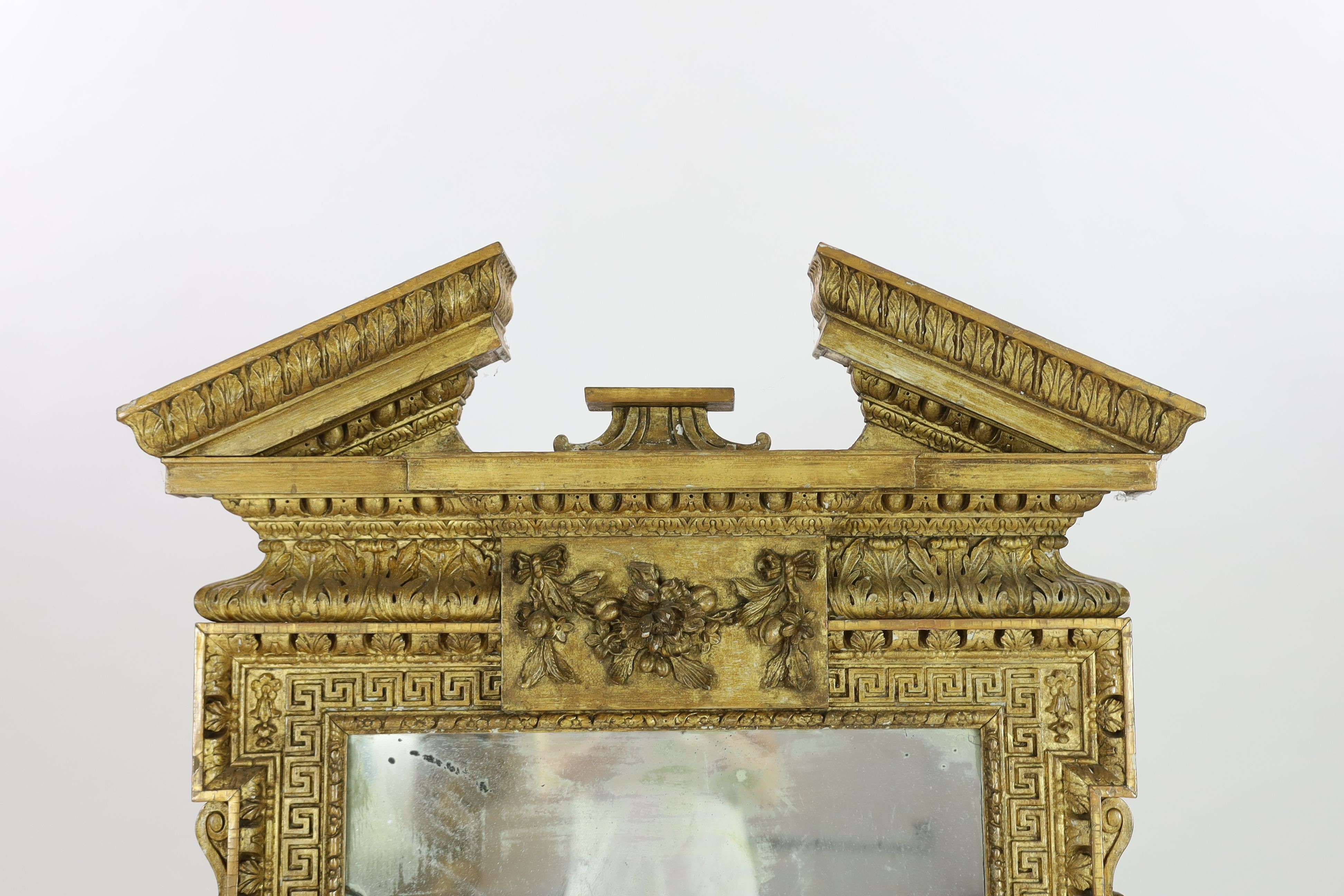 A George II carved giltwood William Kent design wall mirror, W.93cm H.162cm